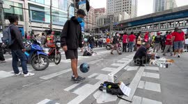 Teenager shows off keepy-up skills at Thailand protest