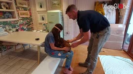 Parents surprise blindfolded daughter with adorable cockapoo puppy