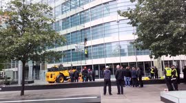 Two Extinction Rebellion protesters climb the HS2 building in London