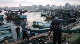 Palestinians buy fishes at fish market after Israel expand the fishing zone in the Gaza Strip to 15 nautical miles