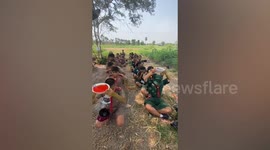 Students play funny water bowl relay game in Thailand