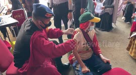 Indonesian police provide free vaccines for beggars and disabled people in Makassar