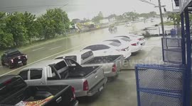 Dozens of cars crash on slippery road after heavy rain storm