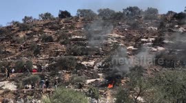 Palestinian protestors clash with Israeli forces following a demonstration against the Israeli outpost of Eviatar