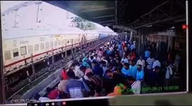 Mother and child rescued after falling between platform and moving train in northern India
