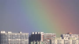 Colourful rainbow over Kudrovo district in St Petersburg, Russia