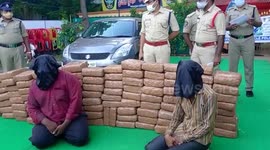 Indian police parade 101kg of cannabis and alleged smugglers in southern India
