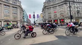 LGBT biker swarm passes by London’s Oxford Circus