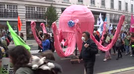 Pink octopus and a little riding horse at Impossible Rebellion 'March for Nature' in London