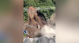 Landslide crashes down mountain and buries workers' dorm in China