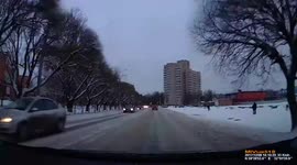 Car Swerves Out of T-Junction into Roadside Barrier on Snowy Street (Dashcam Video)