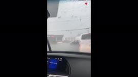 Terrifying moment couple drives through tornado in Maryland