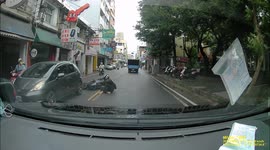 Moped rider rear-ends a car and then almost gets run over by a truck (Dashcam Video)