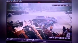 Truck transporting mud flips over and crushes cars after trying to avoid minibus