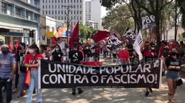 Different shots of Anti-Bolsonaro protesters marching through the streets of Goiânia, Brazil
