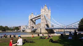 Londoners by Tower Bridge enjoy a late summer heatwave