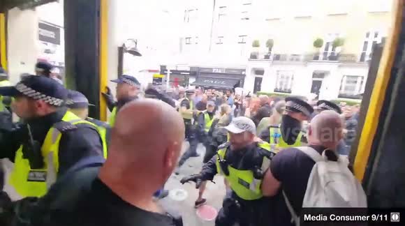 Anti-Vaccine Protestors Scuffle With Police Outside South Kensington Underground Station