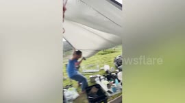 Strong wind blows over family's tent during cmaping lunch