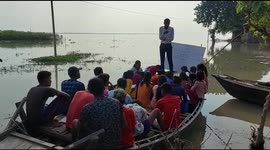 Teachers forced to conduct lessons in boat amid severe flooding in northeastern India