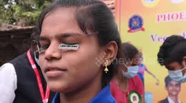 Girl in south India grips razor blades with her EYELIDS and twirls firesticks in record attempt