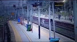 Indian police personal Risked his life & saved a women while she was crossing the railway line in western India