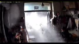 Sleeping woman receives rude awakening as water sprays into shop from broken pipe in China