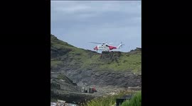 Watch moment woman is airlifted from Cornish beach after 30ft cliff fall