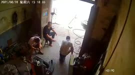 Overinflated tire explodes and hits unlucky man on the head in China