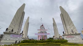 Anti-government protesters throw papers in the air in Bangkok, Thailand