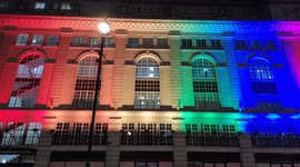Building lit up in rainbow colours in Piccadilly, London