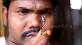 Indian artist creates miniature sculpture of Ganesh ahead of Hindu festival