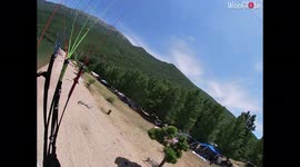 Paraglider misjudges landing and slams headfirst into a tree