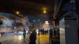 Anarchists hurl smoke bombs during clashes with police in Thailand