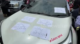 Activists hold drive-by rally in cars and motorcycles in Bangkok, Thailand