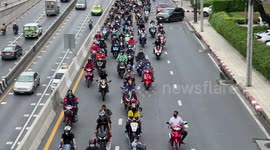 Demonstrators hold drive-by rally in cars and motorcycles in Bangkok, Thailand