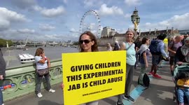 Protesters form human chain against COVID-19 vaccines on Westminster Bridge, London