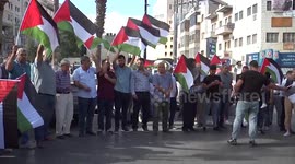 Palestinians take part in a protest in support of prisoners who were arrested following their escape from Gilboa prison
