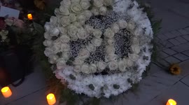 Candles burning at 9/11's Memorial Garden in London