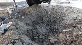 Palestinian inspects site of latest Israeli airstrike