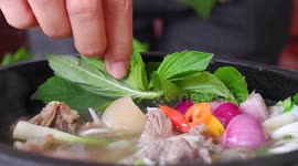 Vietnamese noodle soup made on the spot for diners in restaurant