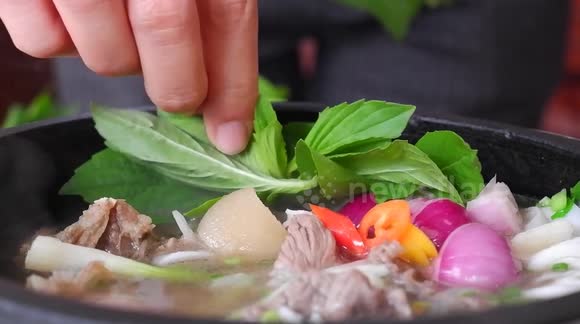 Vietnamese noodle soup made on the spot for diners in restaurant