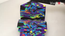 Satisfying ASMR clip shows man slicing multi-coloured sand block