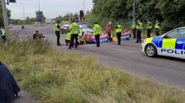 Police arrest Insulate Britain protesters Blocking M25 A41 Watford near Kings Langley UK