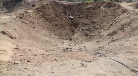 Huge crater in Gaza town from Israeli airstrike after third night of fighting