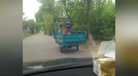 Chinese motorist cannot contain laughter as wheels on vehicle wobble uncontrollably