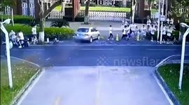 Speeding car narrowly misses university students after Chinese motorist presses accelerator by mistake