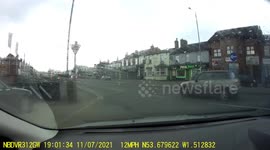 Driver stops traffic to help ducks and ducklings cross a busy dual carriageway.