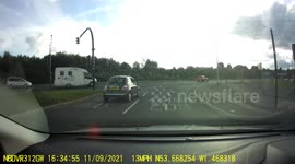 Motorhome accidentally jumps red light almost causing an accident.