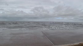 Waves crash against a sea defense in Corpus Christi, Texas, USA as Tropical Storm Nicholas passes just offshore.