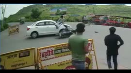 Biker crashes into car ... but sticks perfect landing